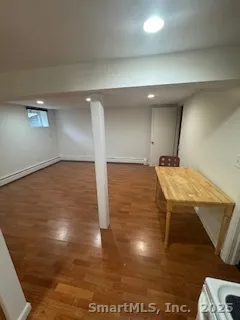 a room with pool table and windows