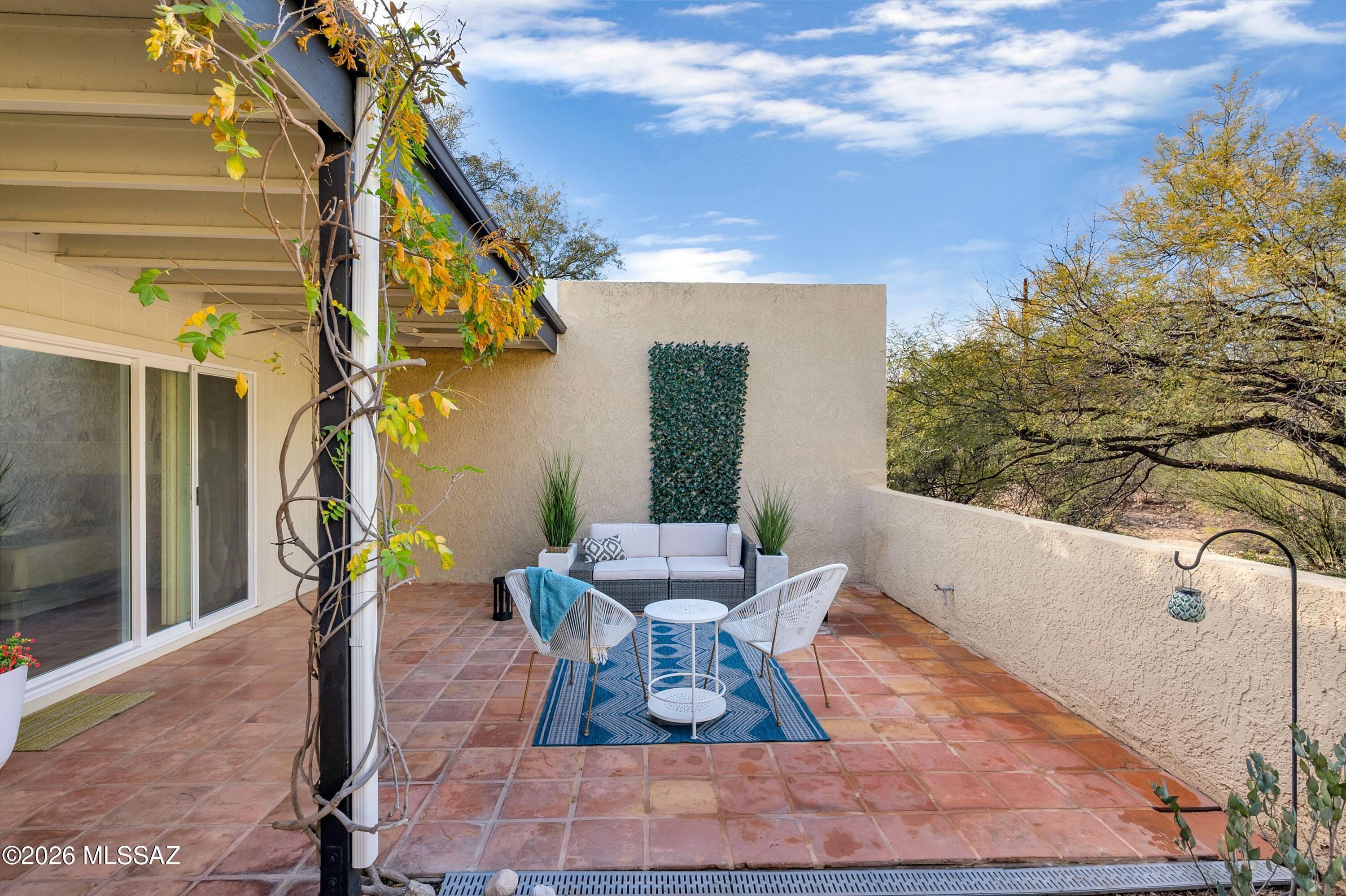 6941 East Rivercrest Road Tucson, AZ 85750 - Photo 22 of 32 a view of a chairs and table in the patio