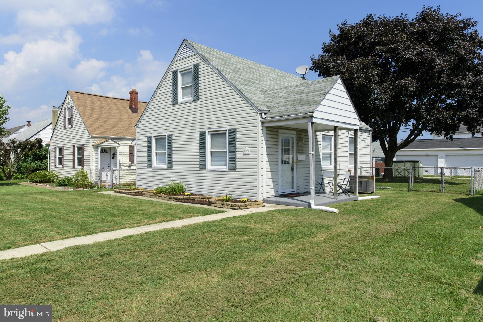 3117 Cornwall Road Baltimore, MD 21222 - Photo 1 of 30 a front view of a house with a garden