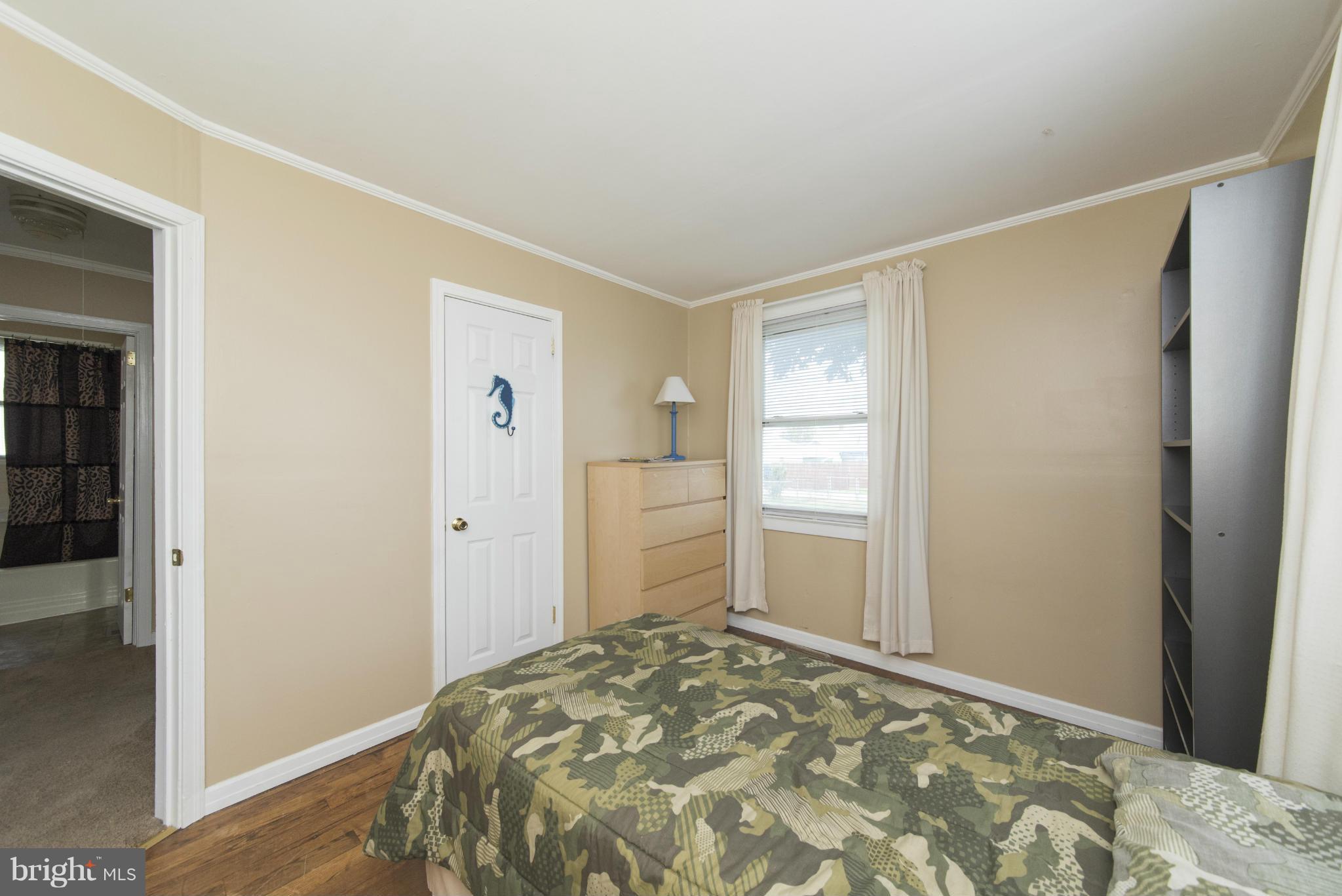 3117 Cornwall Road Baltimore, MD 21222 - Photo 13 of 30 a bedroom with a bed and a window