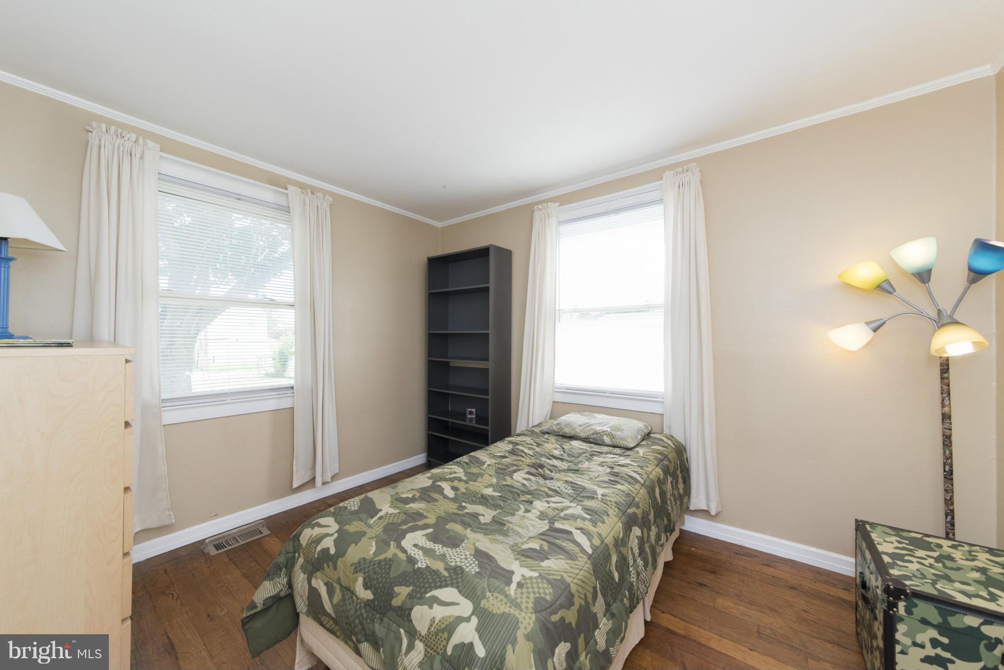 3117 Cornwall Road Baltimore, MD 21222 - Photo 16 of 30 a bedroom with a bed and a window