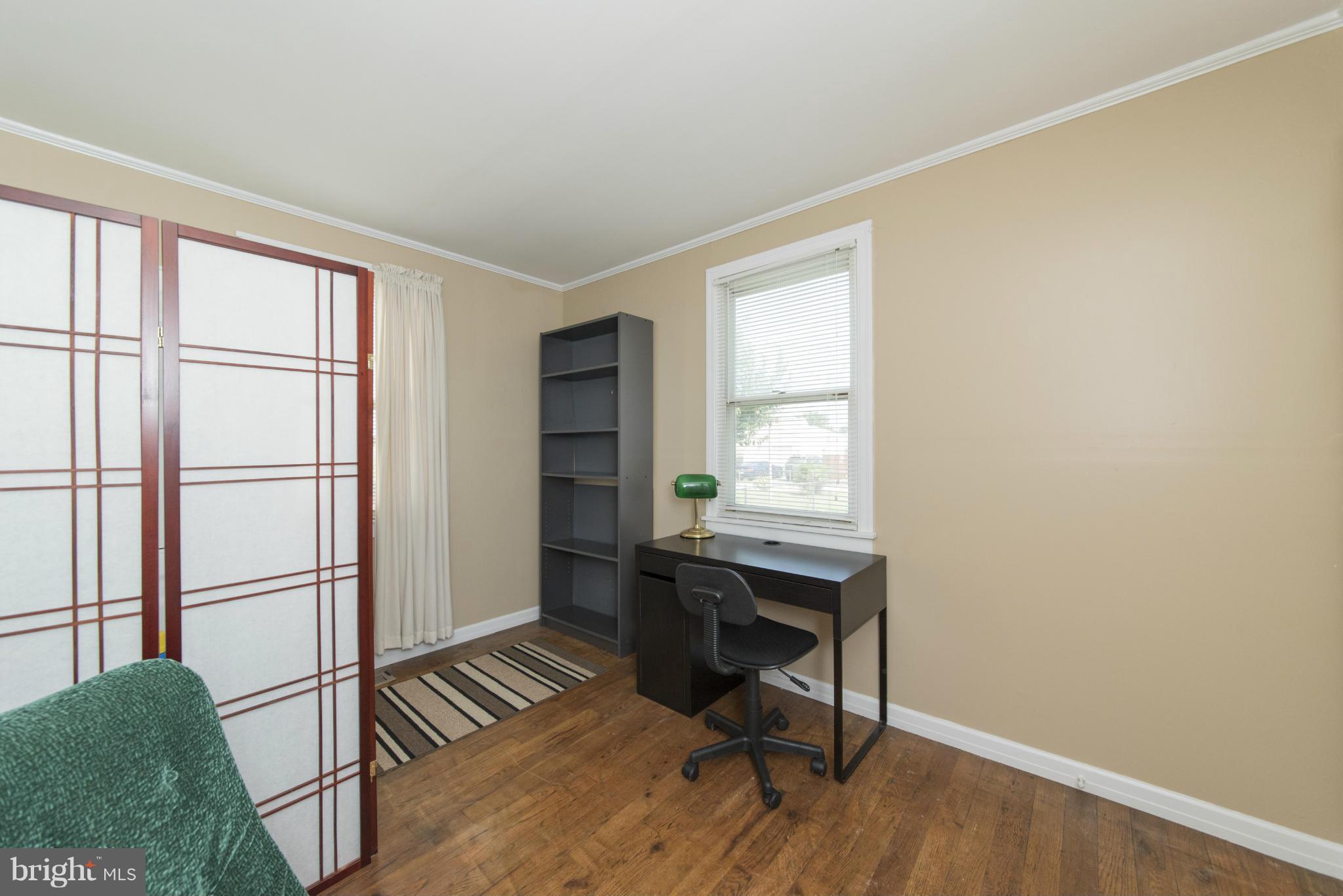 3117 Cornwall Road Baltimore, MD 21222 - Photo 18 of 30 a workspace with wooden floor and a window