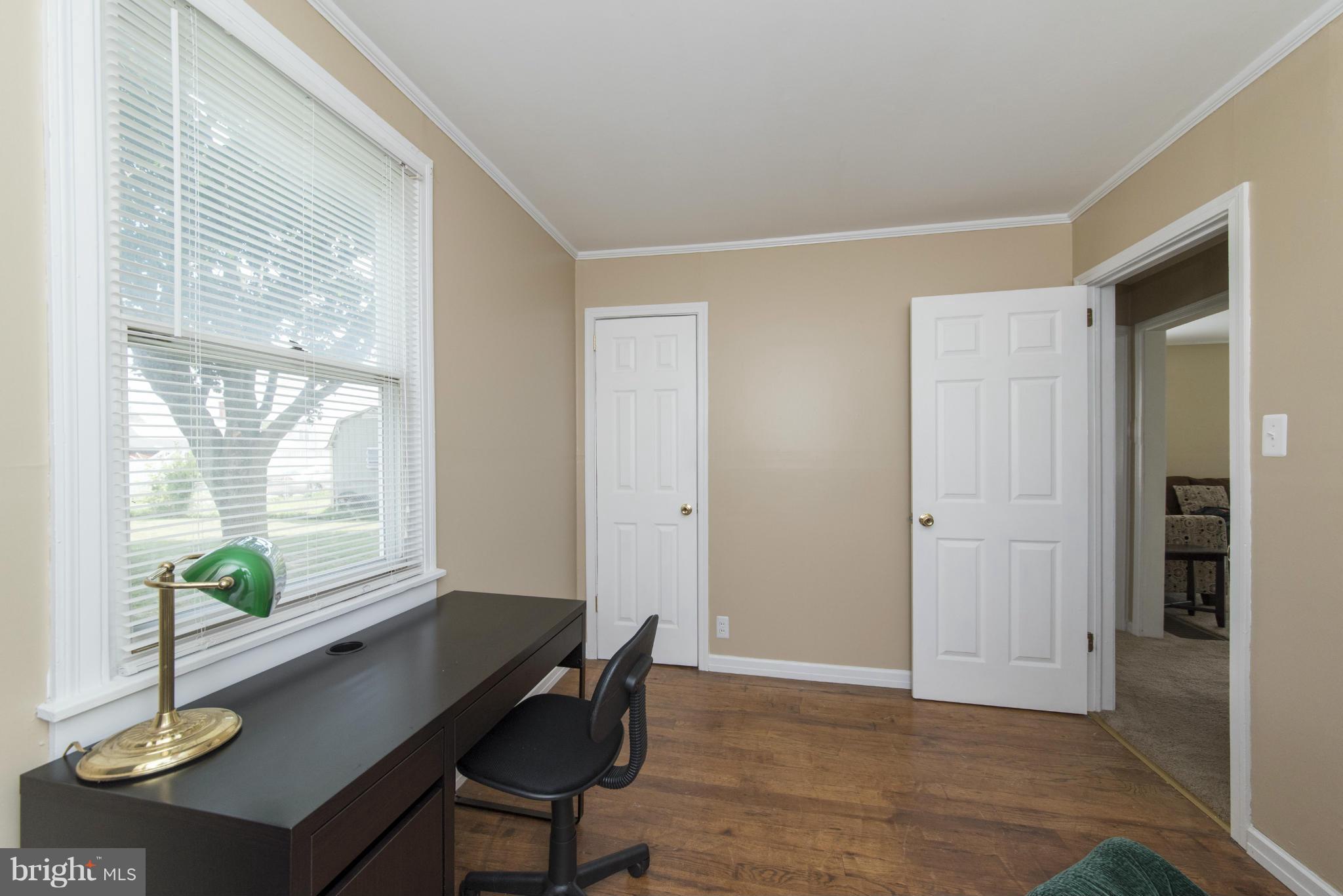 3117 Cornwall Road Baltimore, MD 21222 - Photo 19 of 30 a view of a workspace with furniture and a window