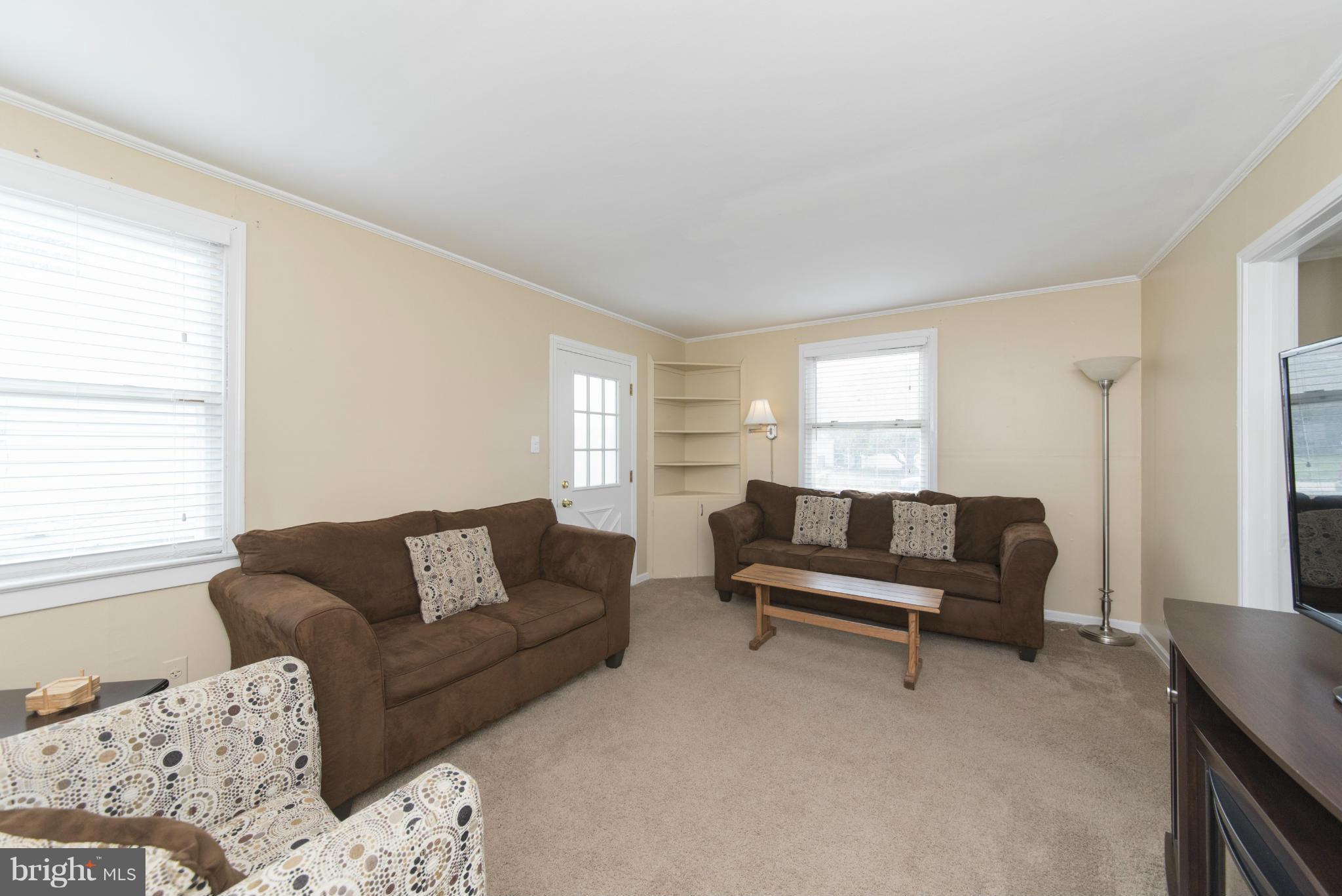 3117 Cornwall Road Baltimore, MD 21222 - Photo 3 of 30 a living room with furniture and a window