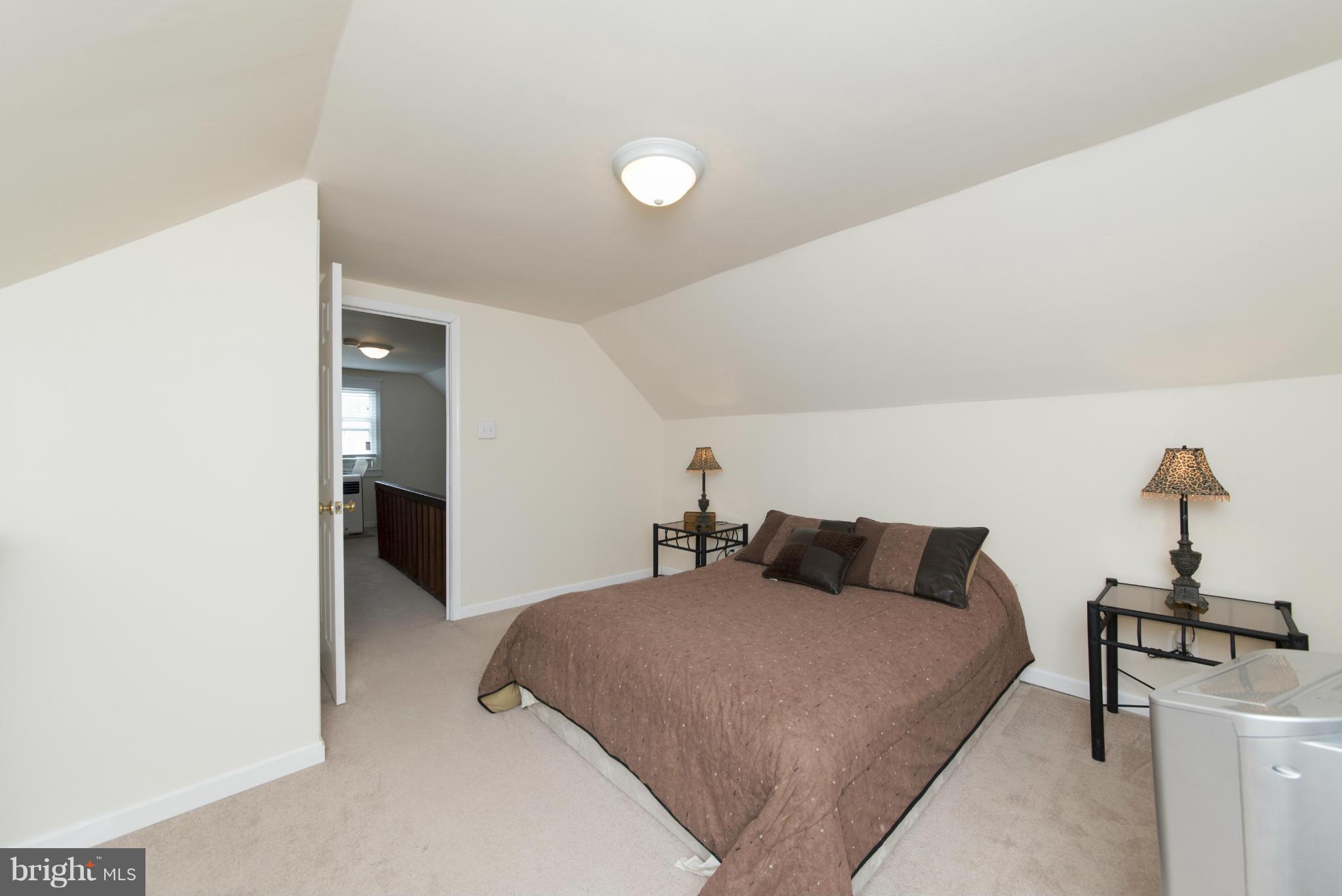 3117 Cornwall Road Baltimore, MD 21222 - Photo 24 of 30 a bedroom with a bed and a table