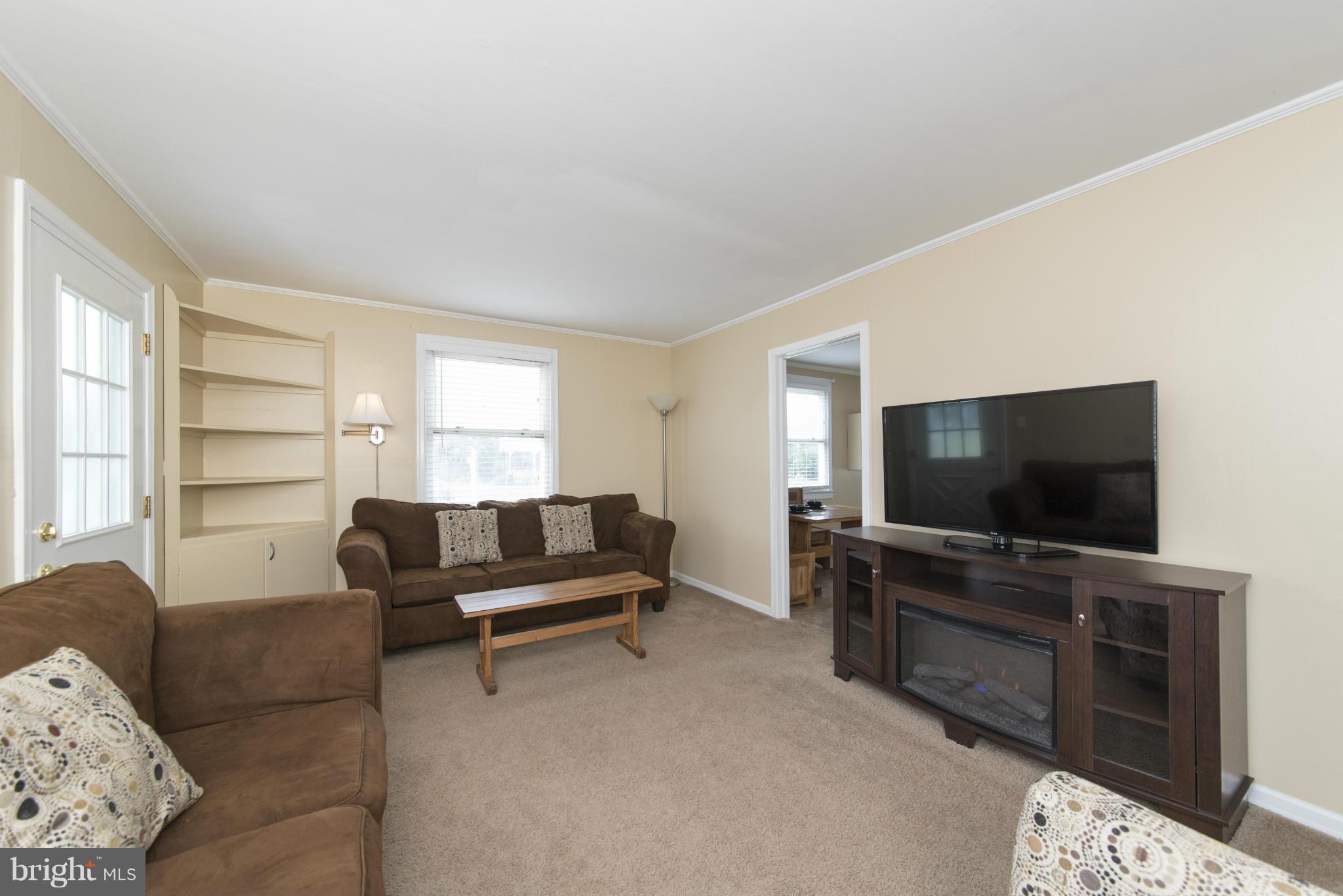 3117 Cornwall Road Baltimore, MD 21222 - Photo 4 of 30 a living room with furniture and a flat screen tv