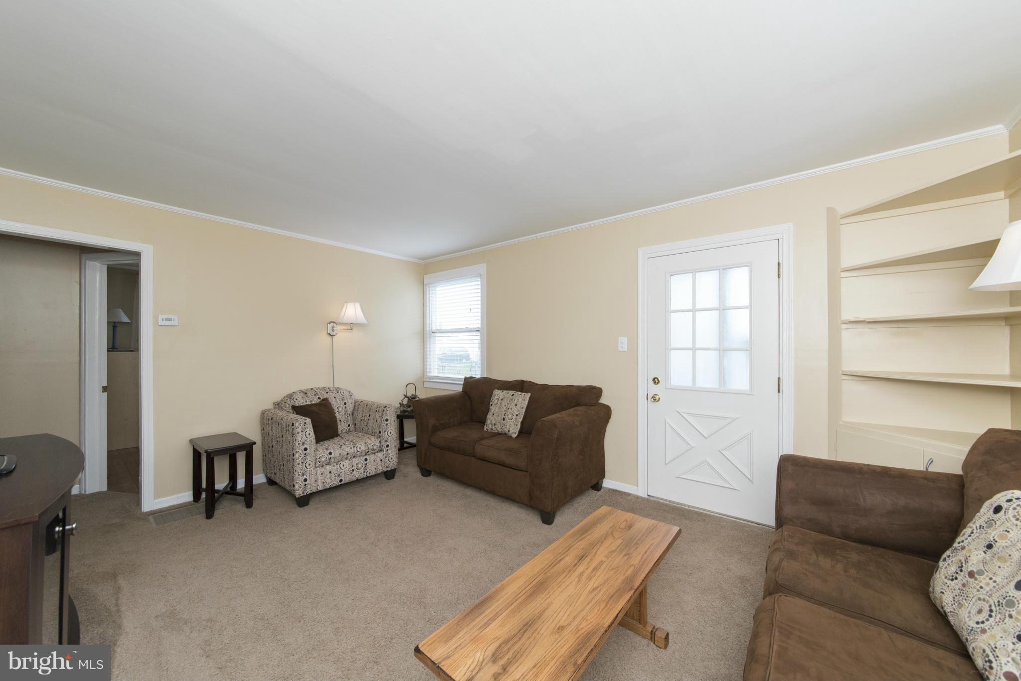 3117 Cornwall Road Baltimore, MD 21222 - Photo 6 of 30 a living room with furniture and a window