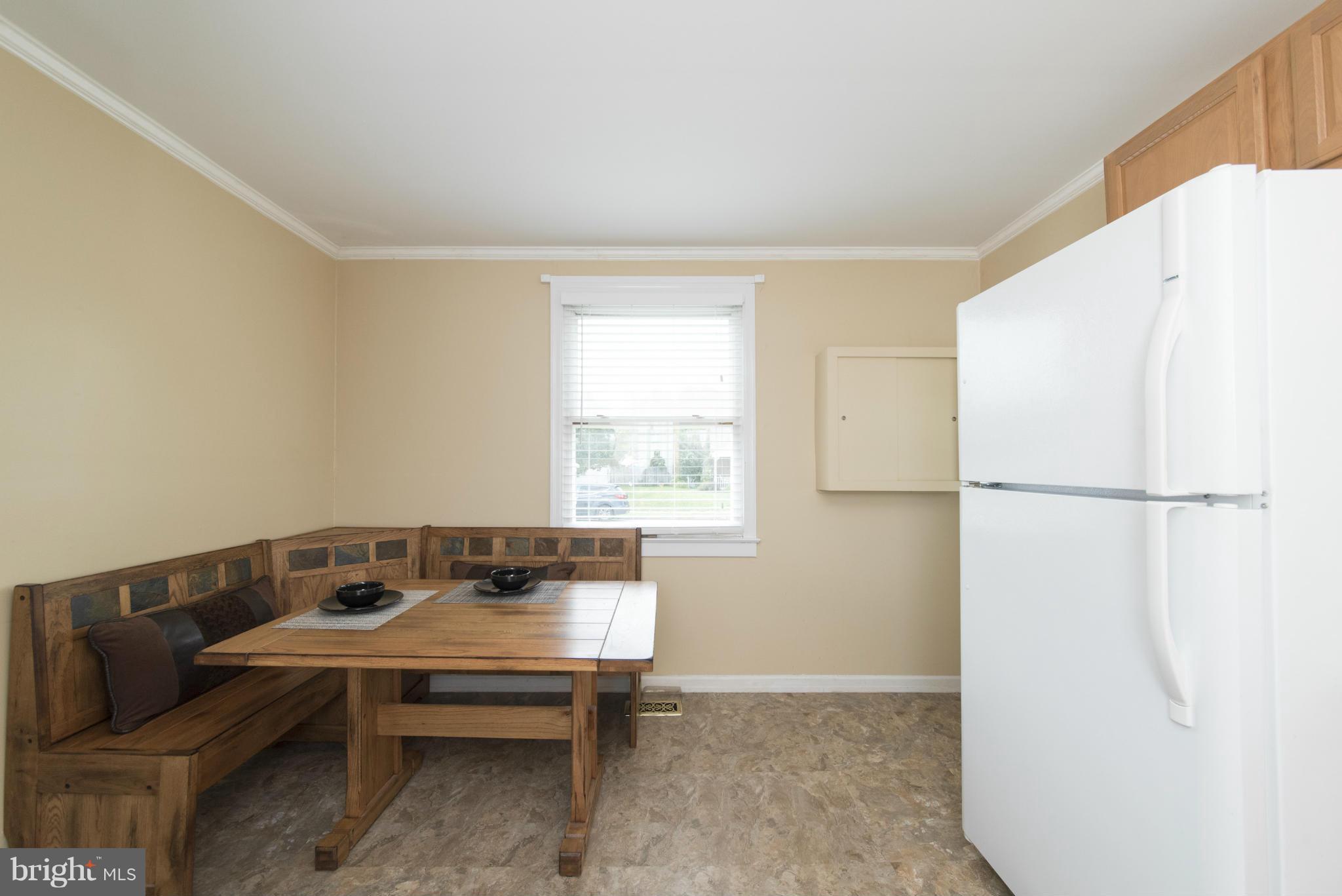 3117 Cornwall Road Baltimore, MD 21222 - Photo 7 of 30 a living room with a table and a window