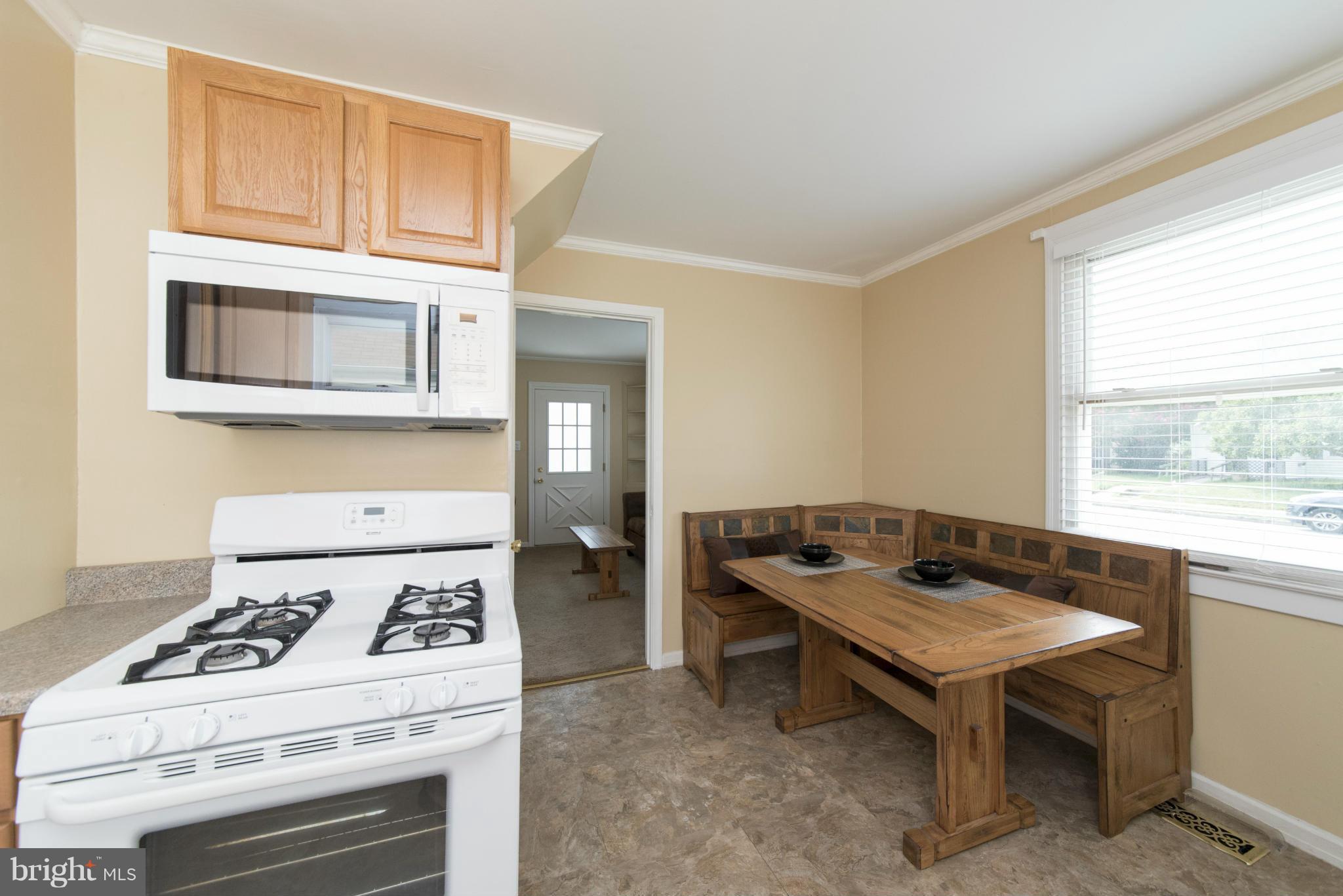 3117 Cornwall Road Baltimore, MD 21222 - Photo 8 of 30 a kitchen with a stove and a microwave