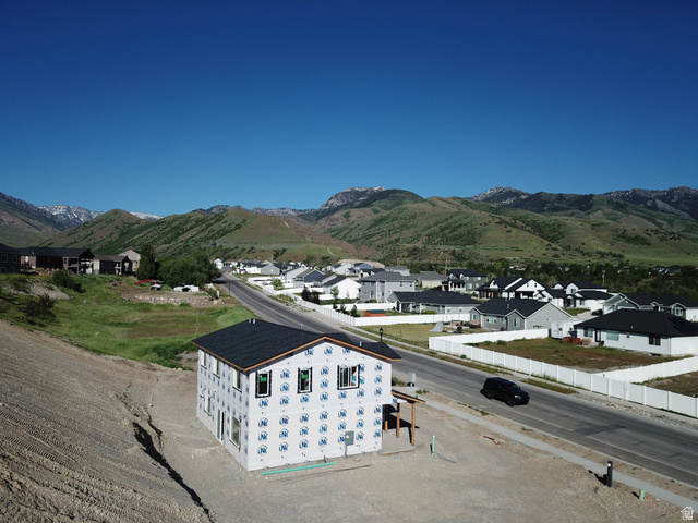 513 East Upper Cyn Road Smithfield, UT 84335 - Photo 4 of 25 New construction residence featuring a dark shingle roof and temporary weather-resistant barrier