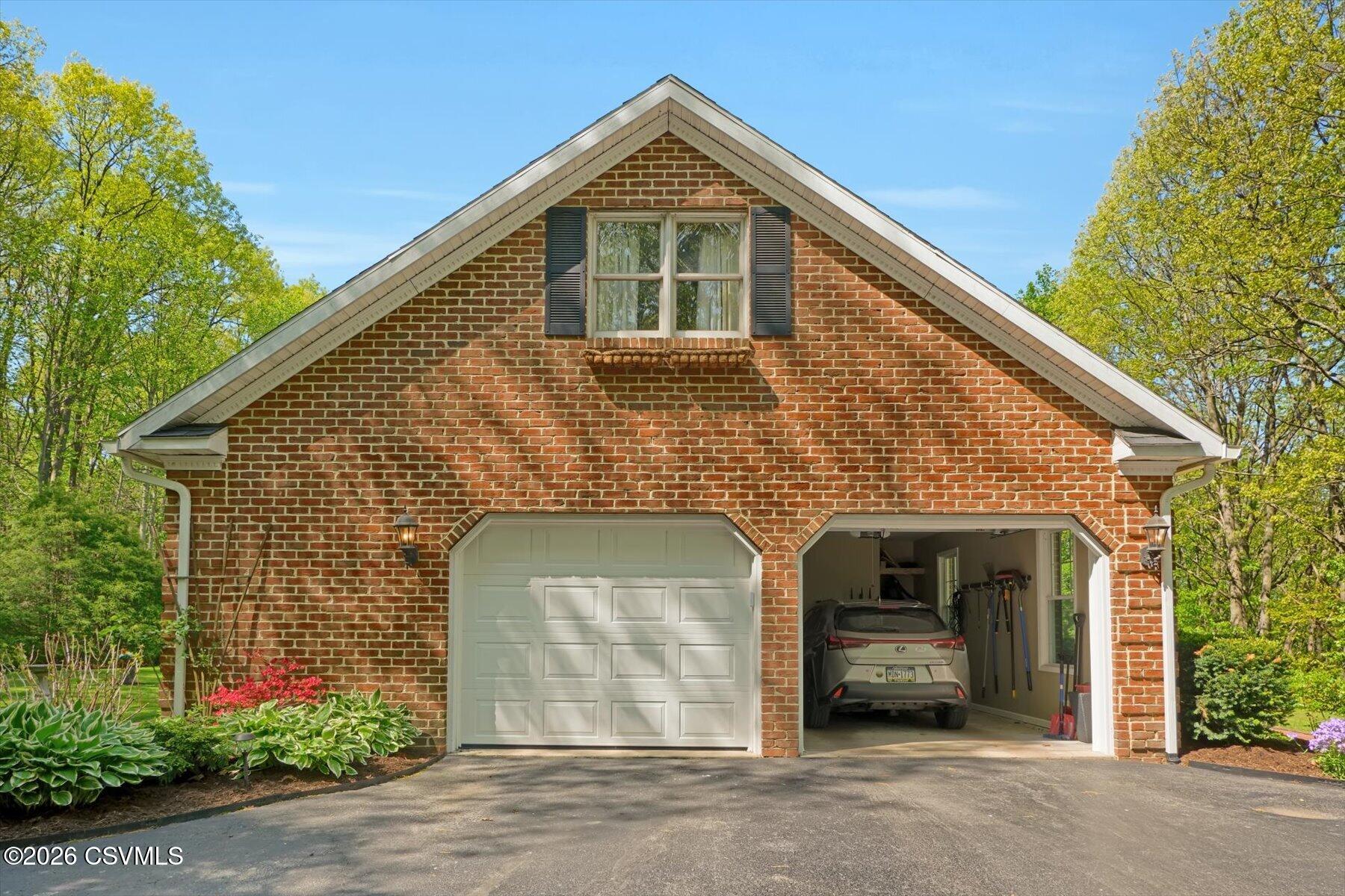 65 Crestview Drive Winfield, PA 17889 - Photo 58 of 70 a front view of a house with a garage