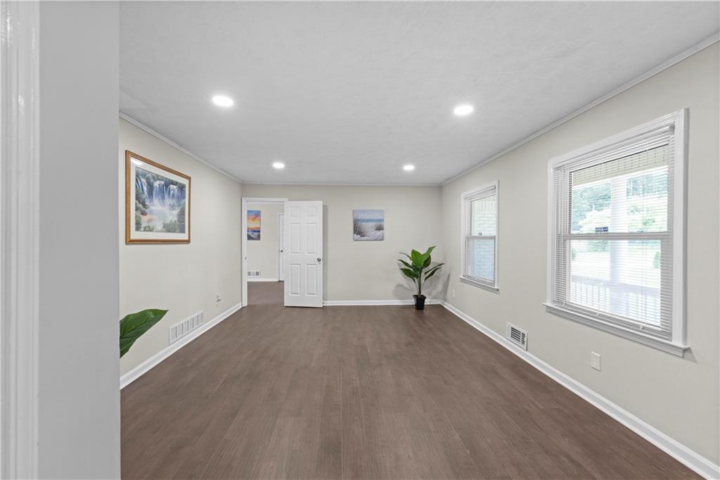 5245 Stonewall Tell Road Atlanta, GA 30349 - Photo 5 of 15 a view of an empty room with a window