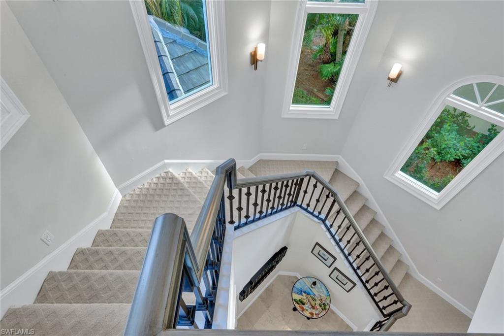 253 Cheshire Way Naples, FL 34110 - Photo 41 of 50 Stairs featuring plenty of natural light