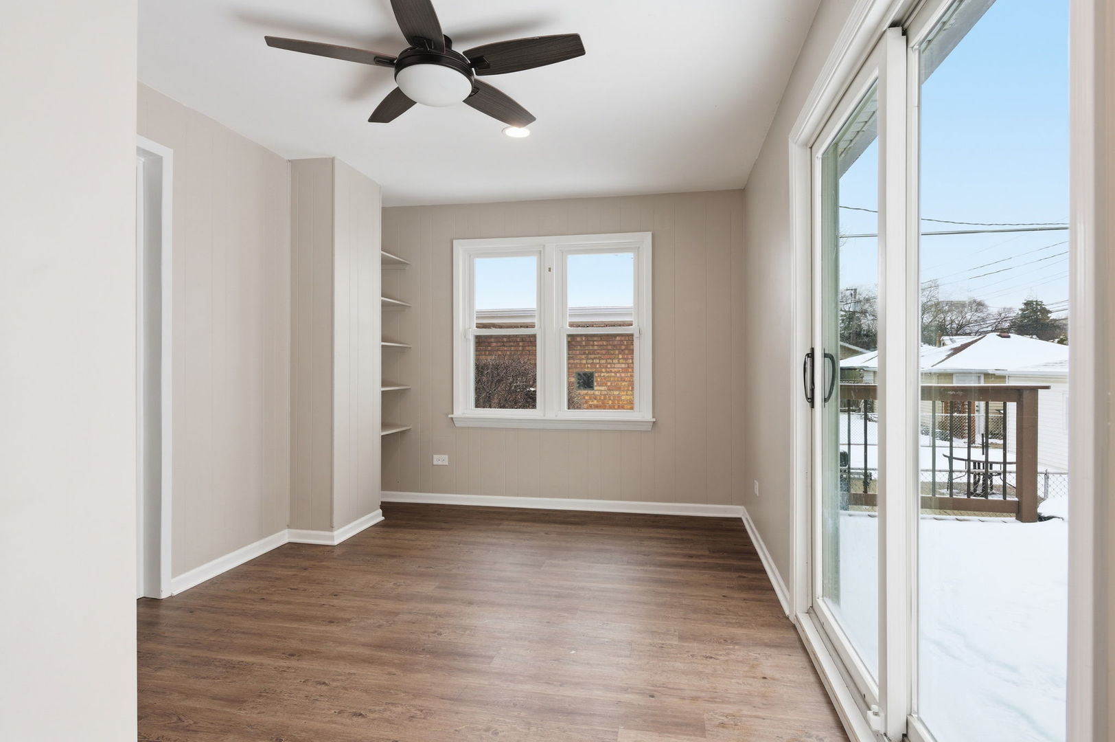 7023 29th Place Berwyn, IL 60402 - Photo 11 of 36 a view of an empty room with wooden floor and a window