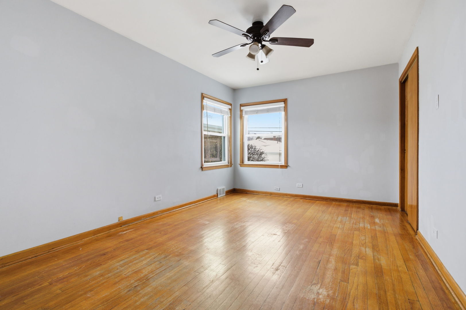 7023 29th Place Berwyn, IL 60402 - Photo 14 of 36 a view of empty room with wooden floor and fan