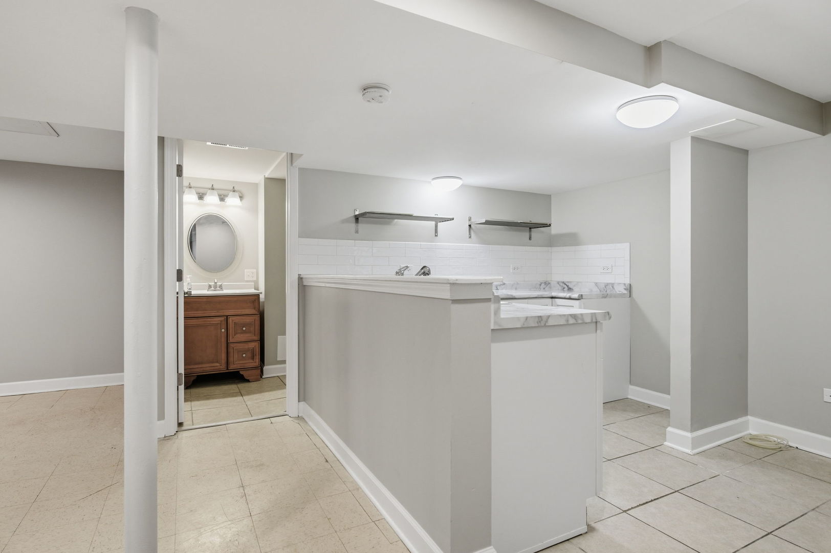 7023 29th Place Berwyn, IL 60402 - Photo 19 of 36 a kitchen with white cabinets and refrigerator