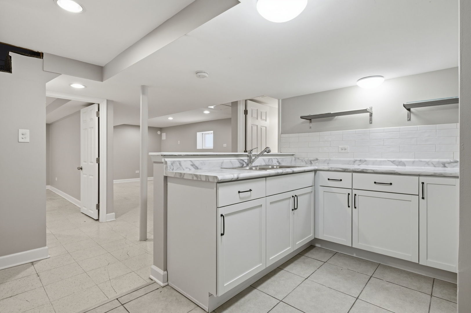 7023 29th Place Berwyn, IL 60402 - Photo 20 of 36 a kitchen with white cabinets appliances and a sink