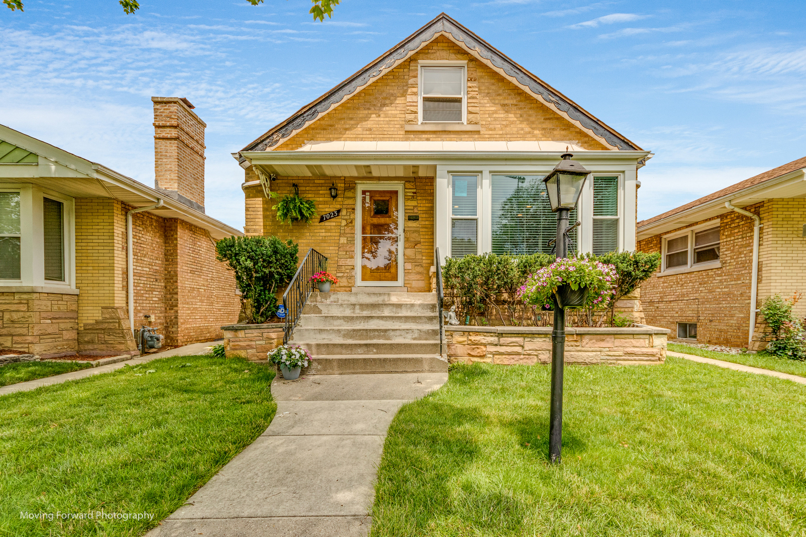 7023 29th Place Berwyn, IL 60402 - Photo 2 of 36 a front view of a house with a yard