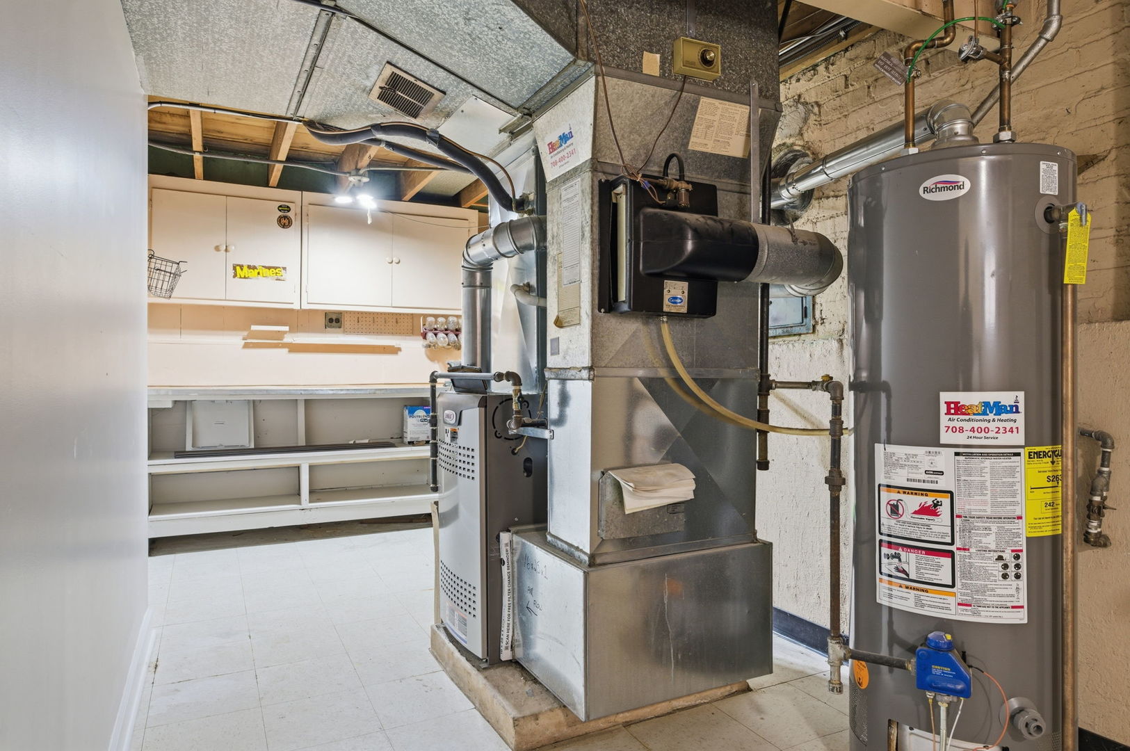 7023 29th Place Berwyn, IL 60402 - Photo 26 of 36 a view of storage and utility room with racks on the wall