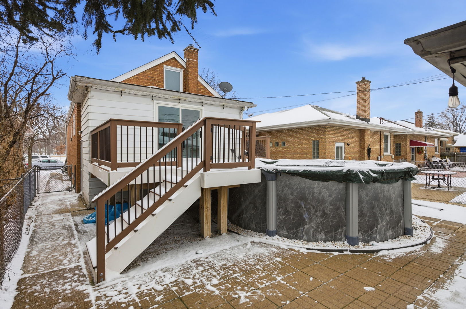7023 29th Place Berwyn, IL 60402 - Photo 28 of 36 a view of a house with pool and roof