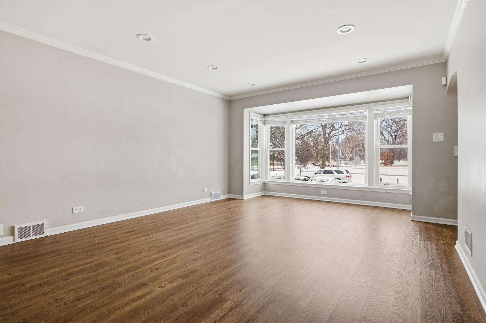 7023 29th Place Berwyn, IL 60402 - Photo 4 of 36 wooden floor in an empty room with a window