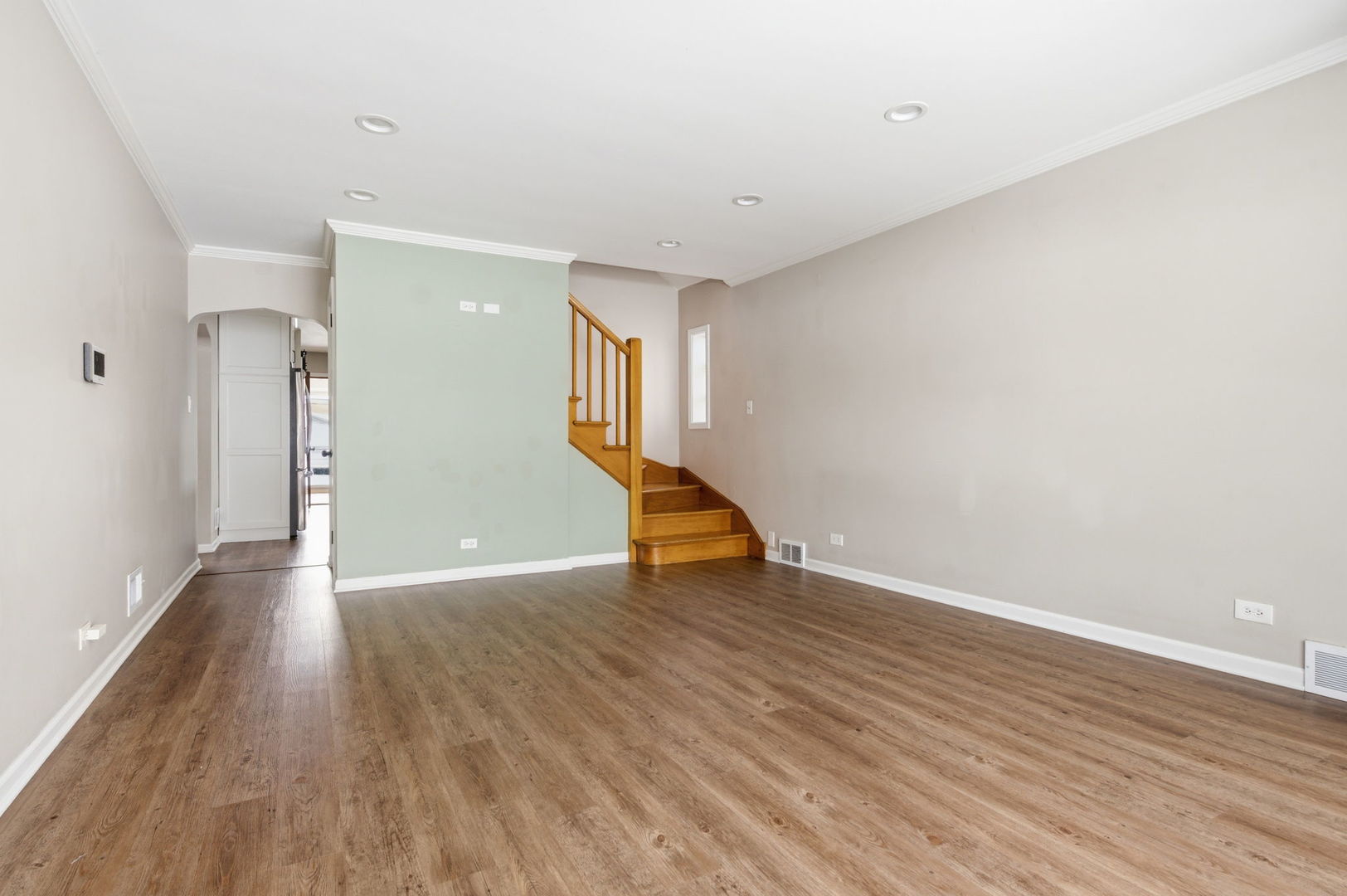 7023 29th Place Berwyn, IL 60402 - Photo 5 of 36 a view of an empty room with wooden floor and a window