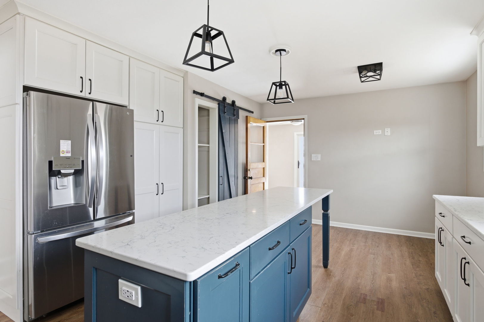 7023 29th Place Berwyn, IL 60402 - Photo 8 of 36 a kitchen with a table chairs refrigerator and microwave