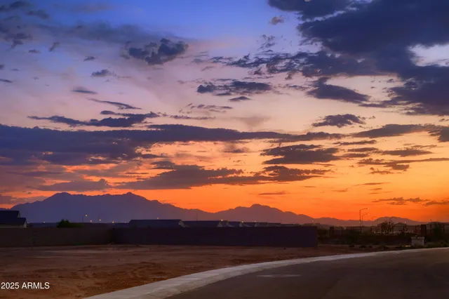 a view of an ocean with a mountain in the background