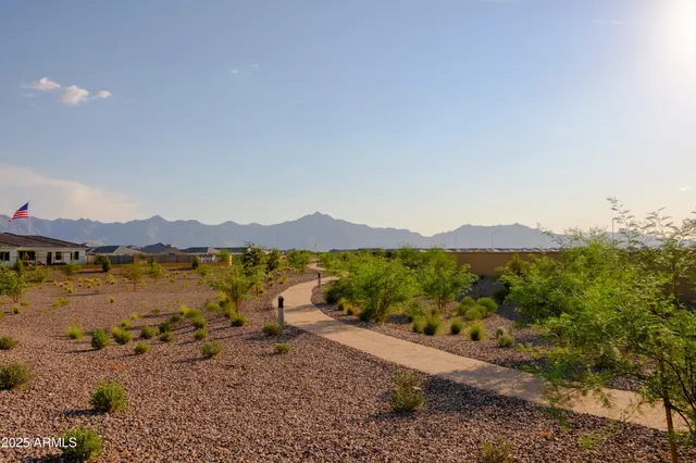 a view of a town with mountains in the background