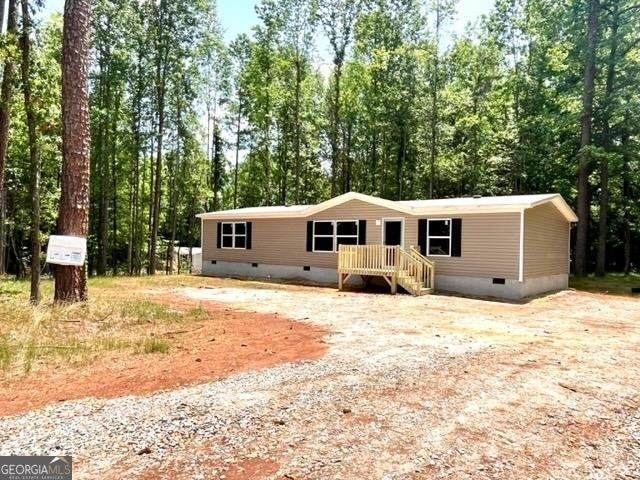 1570 Crumps Bridge Road Martin, GA 30557 - Photo 1 of 1 a front view of a house with a yard covered in snow