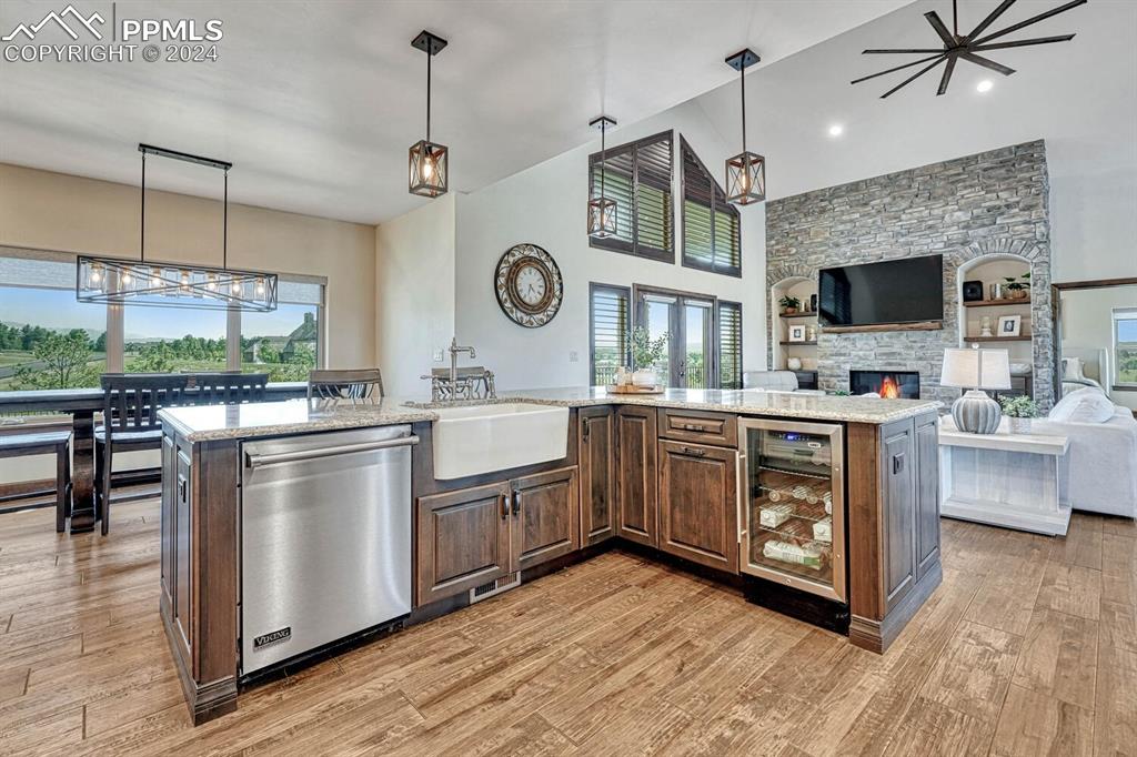 19210 Royal Troon Drive Monument, CO 80132 - Photo 13 of 50 a kitchen with stainless steel appliances granite countertop a stove a sink and a refrigerator