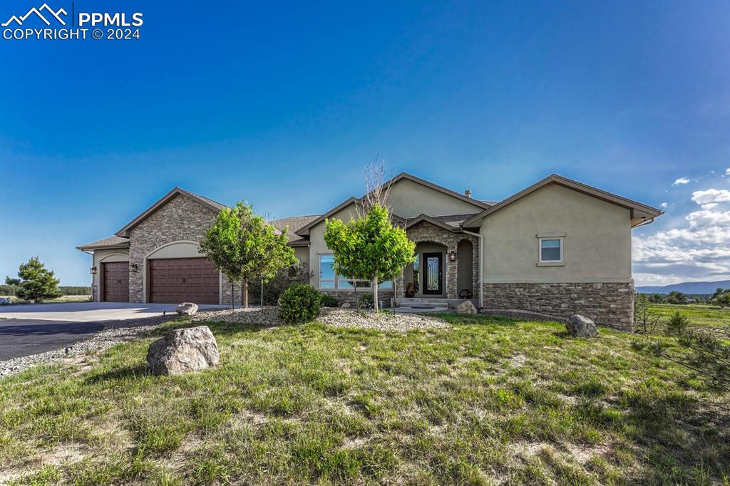 19210 Royal Troon Drive Monument, CO 80132 - Photo 2 of 50 a house view with a outdoor space