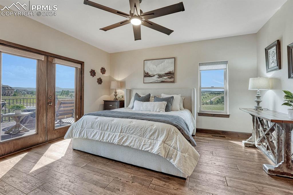 19210 Royal Troon Drive Monument, CO 80132 - Photo 21 of 50 a living room with a bed furniture and a window