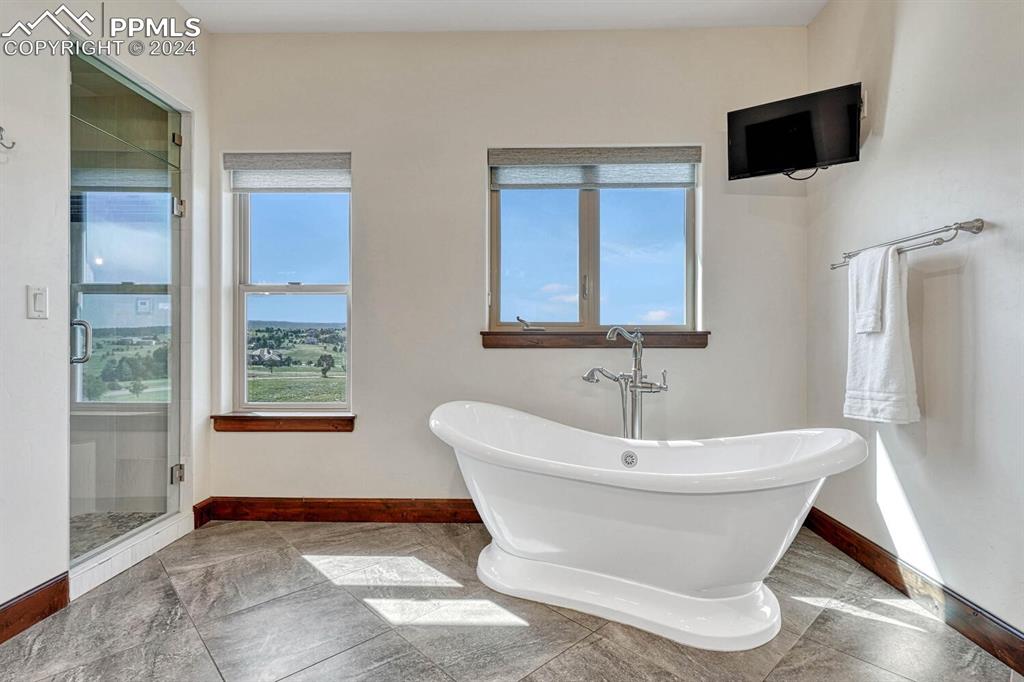 19210 Royal Troon Drive Monument, CO 80132 - Photo 24 of 50 a white bath tub sitting in a bathroom