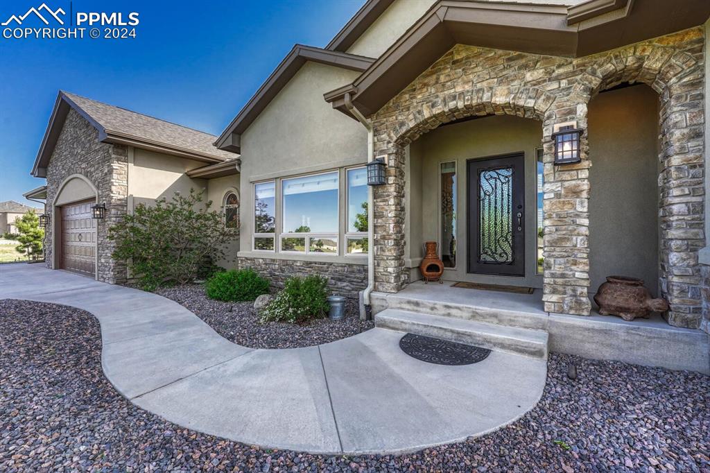19210 Royal Troon Drive Monument, CO 80132 - Photo 3 of 50 a view of a house with entrance gate