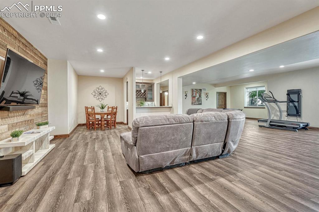19210 Royal Troon Drive Monument, CO 80132 - Photo 32 of 50 a living room with furniture and a flat screen tv