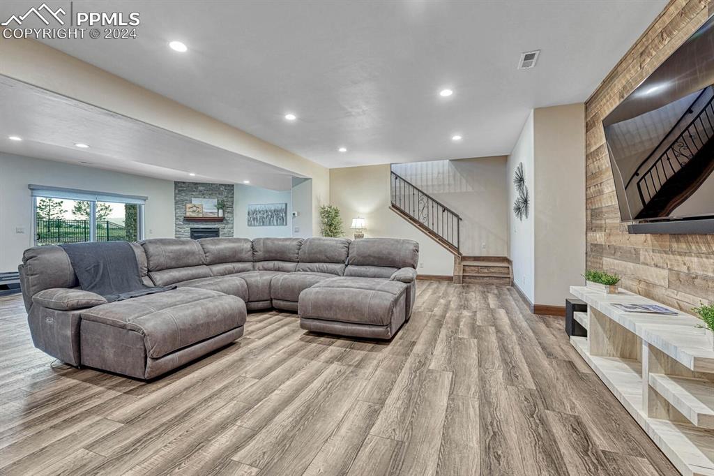 19210 Royal Troon Drive Monument, CO 80132 - Photo 33 of 50 a living room with furniture and a flat screen tv