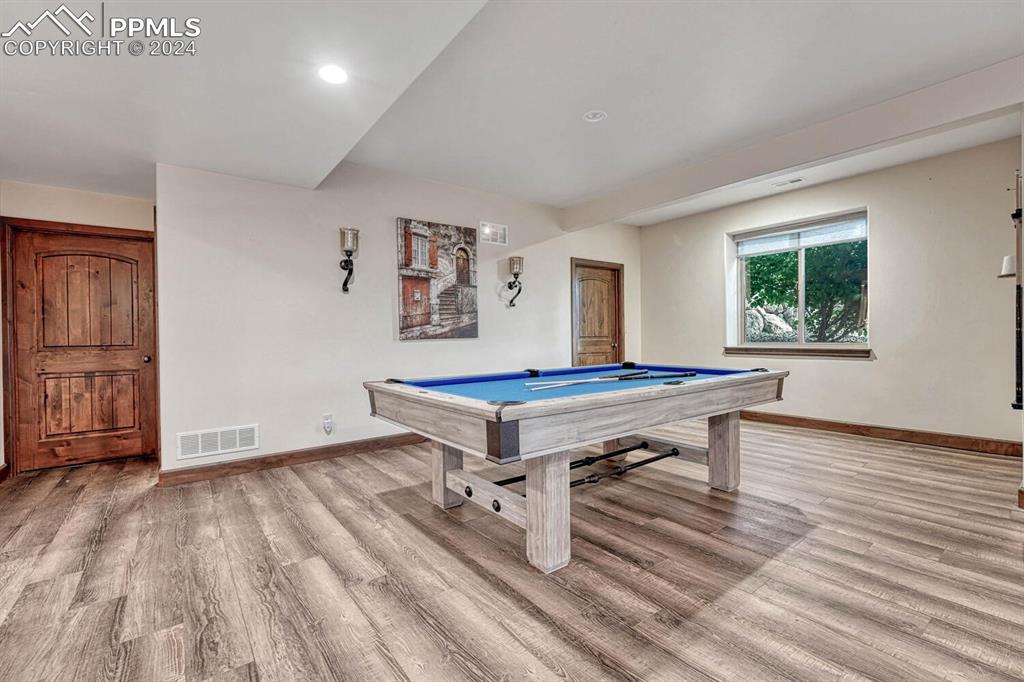 19210 Royal Troon Drive Monument, CO 80132 - Photo 36 of 50 a room with pool table and windows