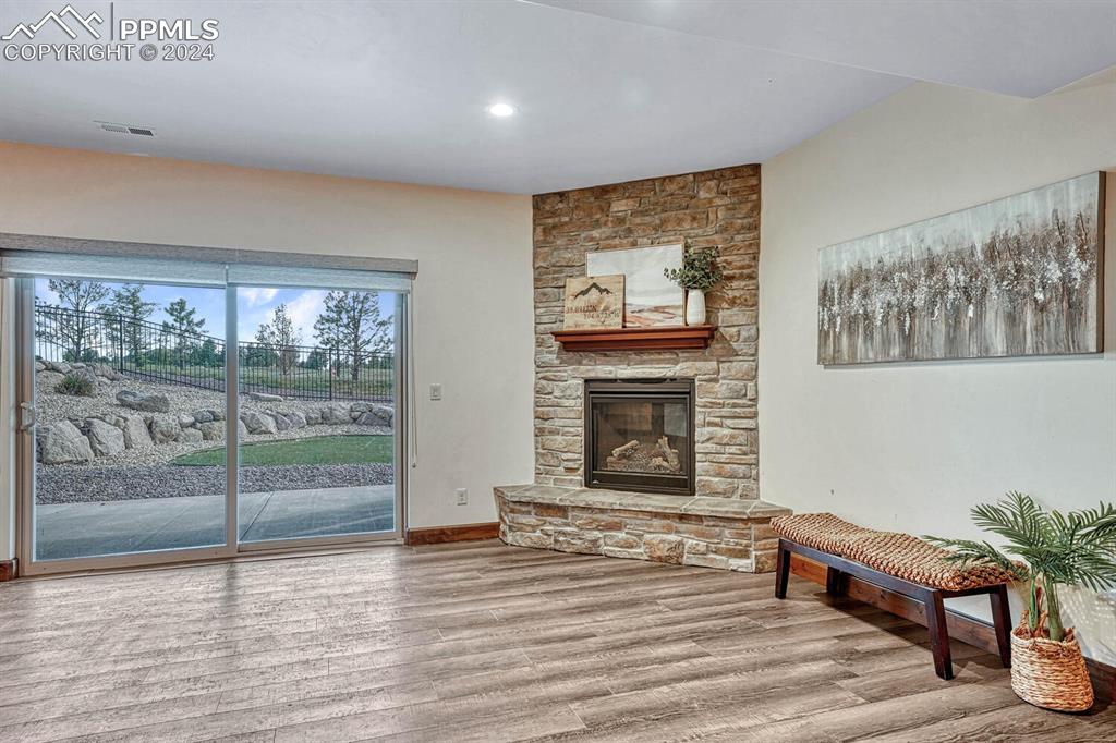 19210 Royal Troon Drive Monument, CO 80132 - Photo 37 of 50 a living room with furniture and a fireplace