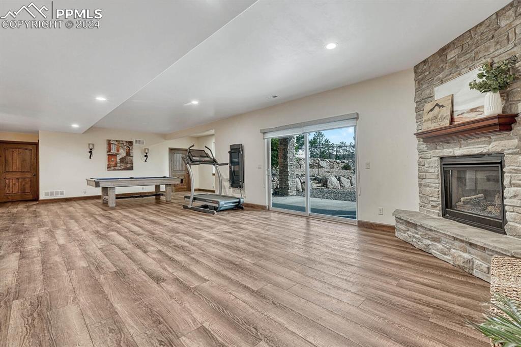 19210 Royal Troon Drive Monument, CO 80132 - Photo 39 of 50 a living room with furniture and a fireplace