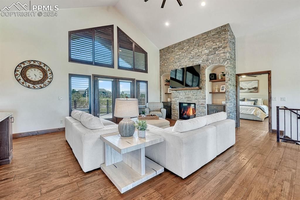 19210 Royal Troon Drive Monument, CO 80132 - Photo 4 of 50 a living room with fireplace furniture and a flat screen tv