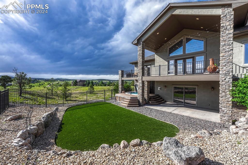 19210 Royal Troon Drive Monument, CO 80132 - Photo 49 of 50 a view of a porch with a yard