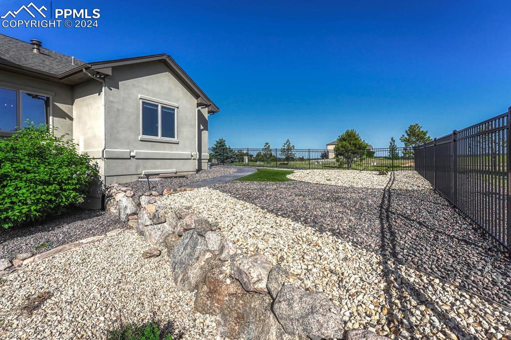 19210 Royal Troon Drive Monument, CO 80132 - Photo 50 of 50 a view of a backyard with a garden