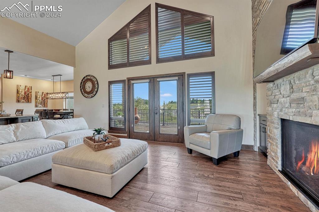 19210 Royal Troon Drive Monument, CO 80132 - Photo 6 of 50 a living room with furniture and a fireplace
