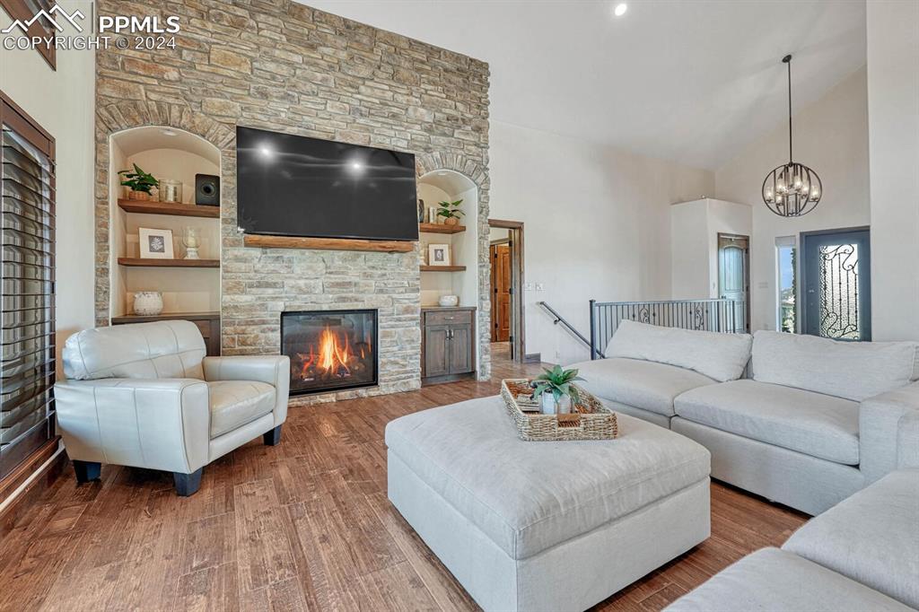 19210 Royal Troon Drive Monument, CO 80132 - Photo 7 of 50 a living room with furniture and a fireplace