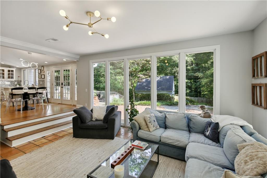 1403 Moores Mill Road Northwest Atlanta, GA 30327 - Photo 16 of 30 a living room with furniture and a large window