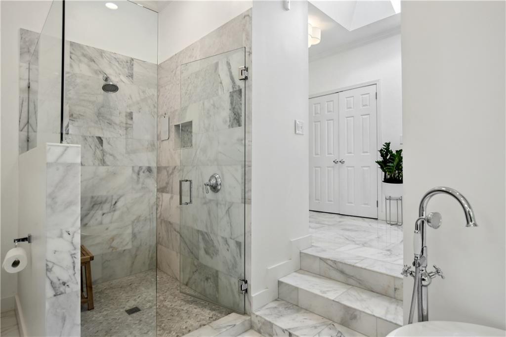 1403 Moores Mill Road Northwest Atlanta, GA 30327 - Photo 23 of 30 a bathroom with a shower and a sink
