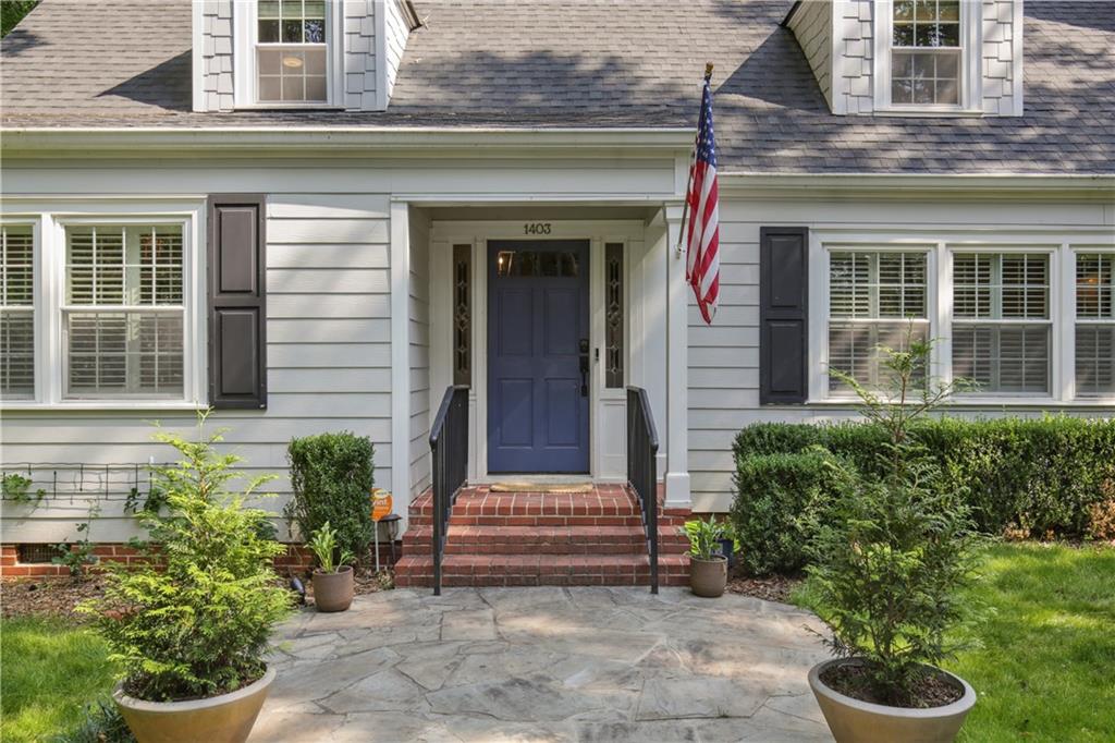 1403 Moores Mill Road Northwest Atlanta, GA 30327 - Photo 3 of 30 a front view of a house