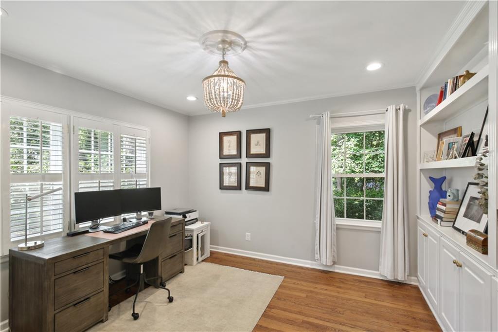 1403 Moores Mill Road Northwest Atlanta, GA 30327 - Photo 4 of 30 a view of a workspace with furniture and a window