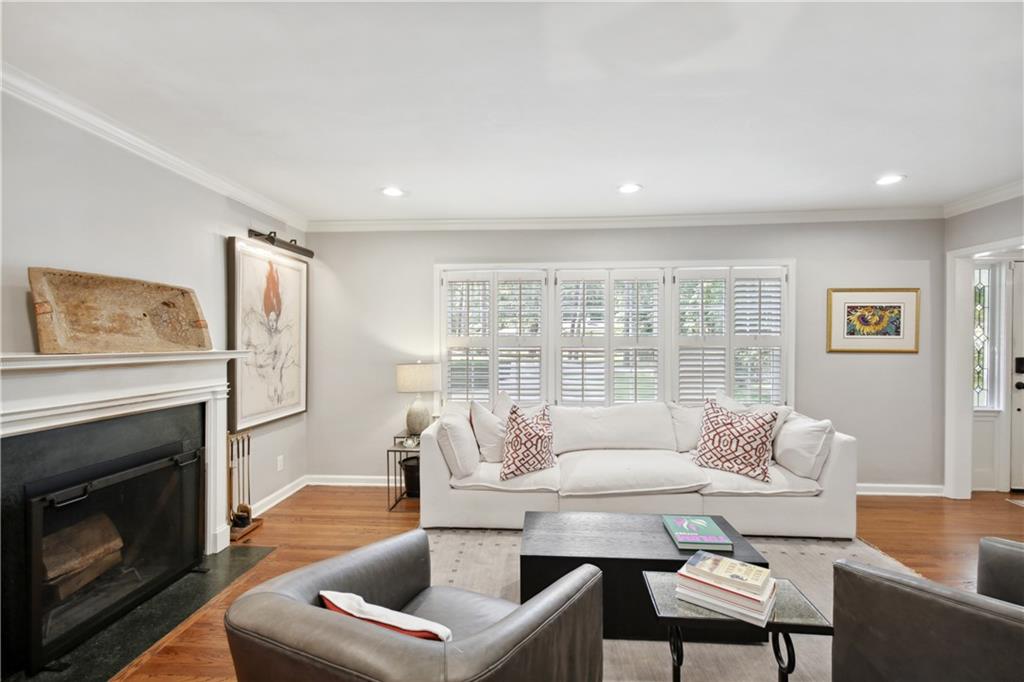 1403 Moores Mill Road Northwest Atlanta, GA 30327 - Photo 7 of 30 a living room with furniture and a fireplace